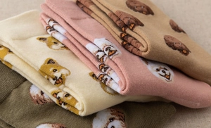 Close-up of knitted cotton crew socks featuring cute cartoon dog patterns in various colors