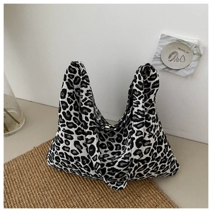 Detail of trendy leopard print canvas tote bag with spacious interior for daily commute