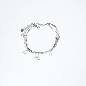 Silver evil eye multi-layer bracelet with star pendants and snake chain on white background