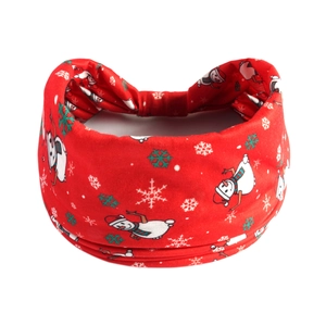 Detail of red Christmas headband with snowman and snowflake patterns on soft fabric