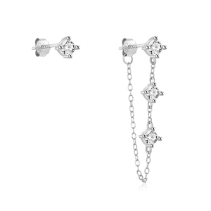 Macro shot of S925 sterling silver stamp and asymmetric chain tassel earring detail