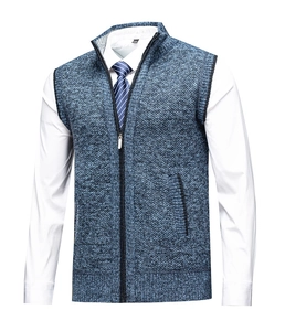 Close-up of blue knit vest texture showing zipper closure and ribbed stand collar detail