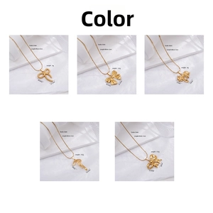 Detailed view of five gold bow pendants on snake chains with precise dimensions