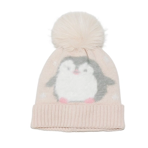 Detail of baby girl knitted beanie featuring a plush penguin motif and large fluffy pompom