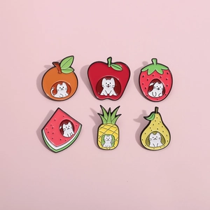 6-piece cartoon enamel pin set featuring white cats inside fruit shapes on pink background