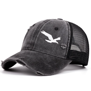 Retro charcoal grey distressed trucker hat with white bird embroidery and mesh back
