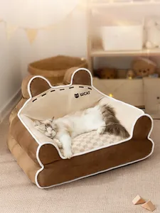 Detailed view of the soft teddy bear ears and plush texture on this cozy pet sofa bed