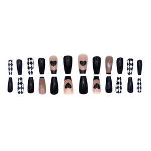 Long ballerina press-on nails set with black heart patterns and checkerboard design
