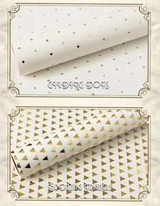 Detailed view of white gift paper with gold foil bronzing dots and triangle patterns