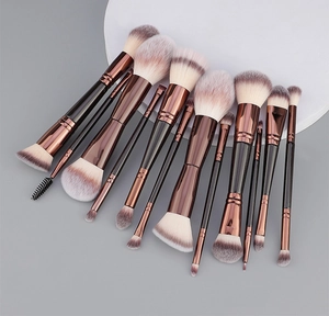 Detail of professional 12-piece dual-ended makeup brushes with fiber bristles and bronze ferrules