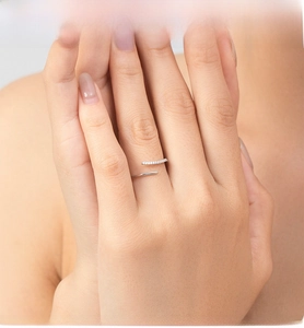 Detail of adjustable S925 sterling silver ring with delicate cubic zirconia stones