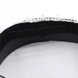Detail view of leopard heart navy hat featuring elastic strap and silver sequin accents