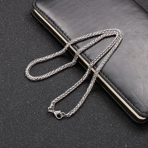 Detail of silver wheat chain necklace in stainless steel with secure lobster clasp