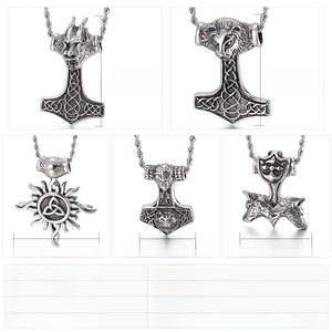 Detailed view of men's stainless steel punk pendants featuring dragon and lion head designs