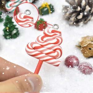Detailed view of red and white twisted candy cane Christmas tree pendant with metal ring