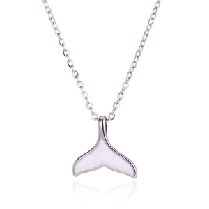 Detailed view of silver whale tail pendant with marble inlay on white reflection