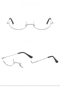 Detailed front and 45-degree side views of silver metal under-rim decorative glasses