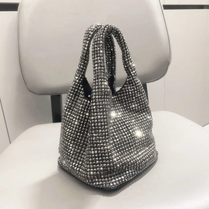 Detailed close-up showing shimmering silver rhinestones and texture of this bucket bag