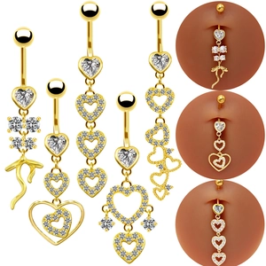 Golden heart-shaped belly rings with full rhinestones shown on white background and model