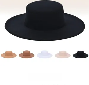 Detailed view of flat top wide brim wool felt hats in black, camel, and beige colors