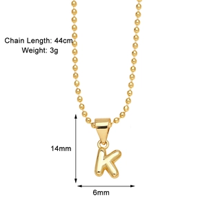Detail view of gold letter K pendant necklace with size dimensions 14mm and 44cm chain length
