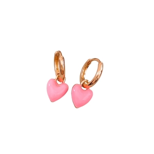 French vintage gold earrings with pink enamel heart pendants on a white background