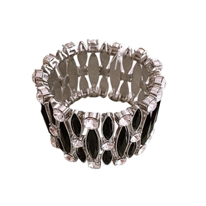 Vintage silver bracelet with black marquise and white round rhinestones on white backdrop