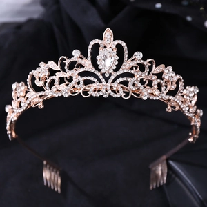 Detailed macro of rose gold bridal tiara with sparkling crystals and drop-shaped gemstone