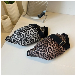 Top view of two leopard print crossbody bags in grey and brown with adjustable straps