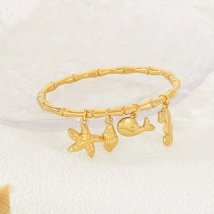 18K gold plated bamboo joint bracelet with marine charms like starfish and whale