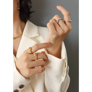 Modern knot design gold jewelry set with necklace earrings and ring on model
