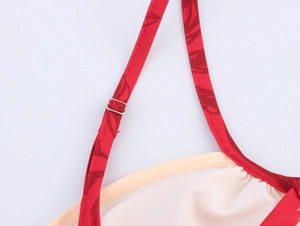 Macro shot of red coconut print fabric with adjustable silver metal strap buckle