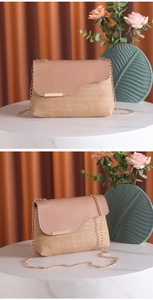 Detail view of woven straw shoulder bag with brown leather flap and gold chain strap