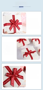 Detail of square white gift box with textured finish and red silk bow with lettering
