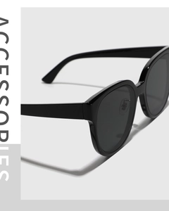 Side view of retro oversized square black sunglasses with polished thick frames