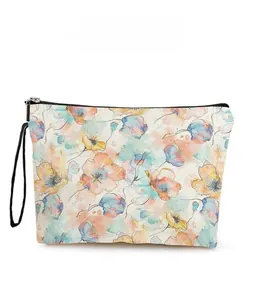 Detailed pattern display of a colorful floral canvas cosmetic bag with black zipper