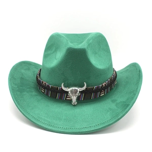 Macro detail of emerald green suede cowboy hat with ethnic band and silver bull skull