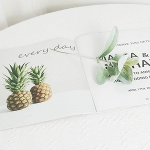 Artificial flocked lamb's ear leaf stems for floral decor in a minimalist white setting