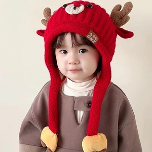 Winter baby knit reindeer hat with earflaps and plush lining in vibrant red color
