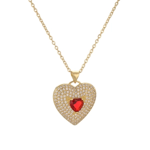 Gold cross necklace featuring a red heart pendant with pave-set zircon stones