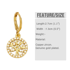 Detailed view of Tree of Life earrings in gold with white cubic zirconia crystals
