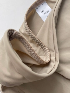 Detail of nude ice silk panties showing 82% nylon fabric and reinforced stitching