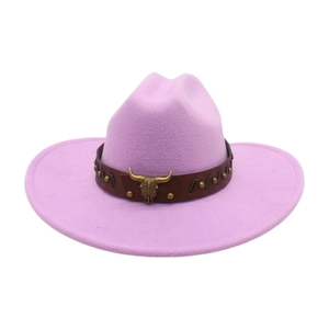 Detail of lavender felt cowboy hat featuring leather band and vintage bull head ornament