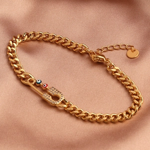 Pulsera de cadena cubana dorada con imperdible de circonita y cuentas de ojo turco