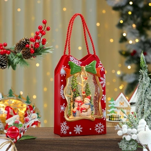 Close-up of lighted Christmas snow globe bag with snowman family and swirling glitter