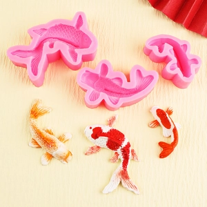 Three pink koi fish silicone molds for fondant cake decorating and chocolate baking