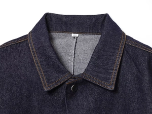 Detailed view of dark blue denim jacket collar with contrast stitching and size label