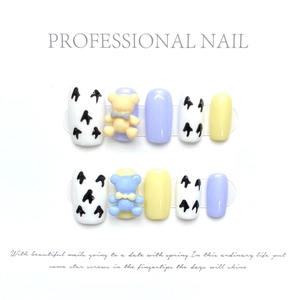 Detail of handmade press-on nails featuring 3D bears and macaron colors in glossy finish