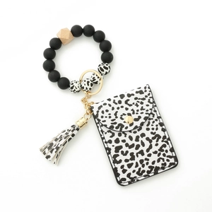 Detail of leopard print card holder and matching silicone bead wristlet with tassel keychain