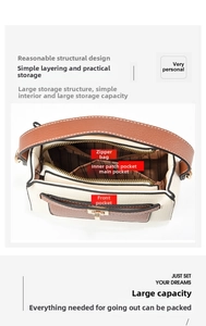 Detail view of the multi-layer interior with zipper pocket and creamy white leather texture